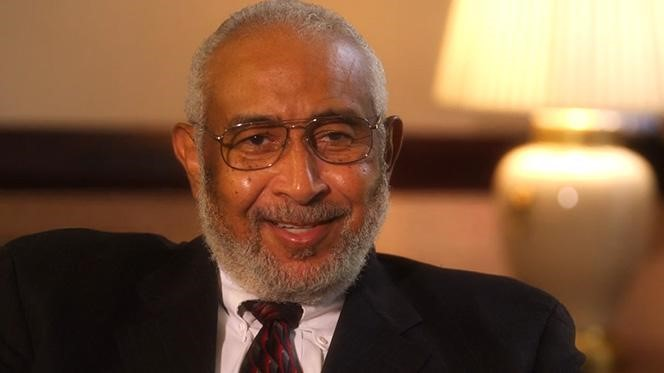 Darius Gray Sitting in a Chair